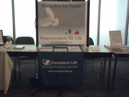 Consistent Life display table at Peace and Justice Studies Association Conference